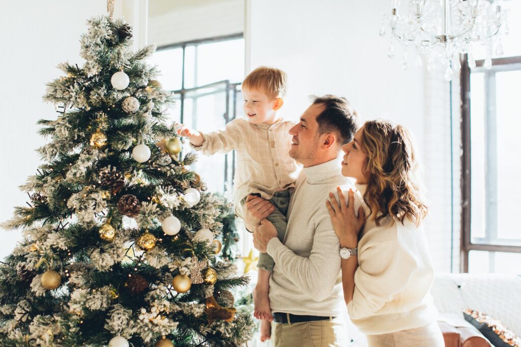 Family decorating Christmas Tree