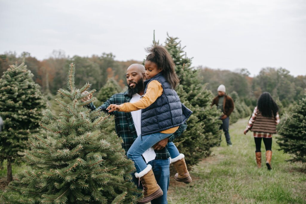 Father and Daughter selecting Christmas tree