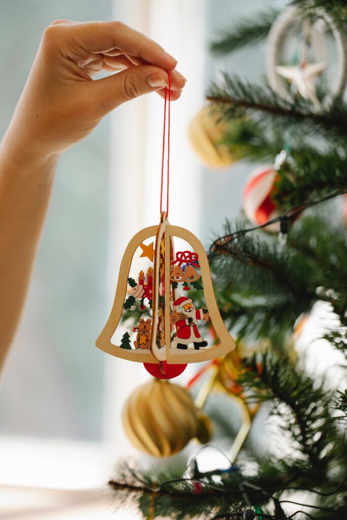 Woman decorating fir tree